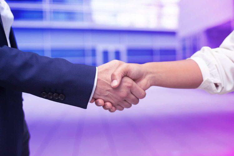 Closeup shot of business handshake. Cropped shot of two people wearing formal suits shaking hands. Business handshake concept